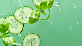 Cucumber slices and basil in water